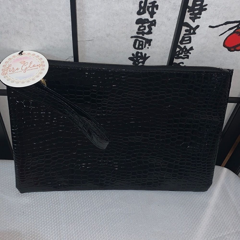 Zipper Black clutch/ wristlet  style purse in faux patent leather.